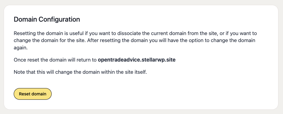 A notification about domain configuration, explaining that resetting the domain allows dissociation or changing of the domain for a site. Once reset, the domain will revert to 'opentradeadvice.stellarwp.site'. There is a yellow "Reset domain" button at the bottom.