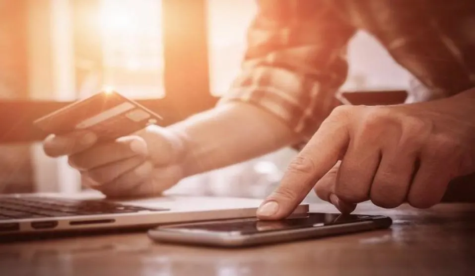 image of a person paying with a credit card
